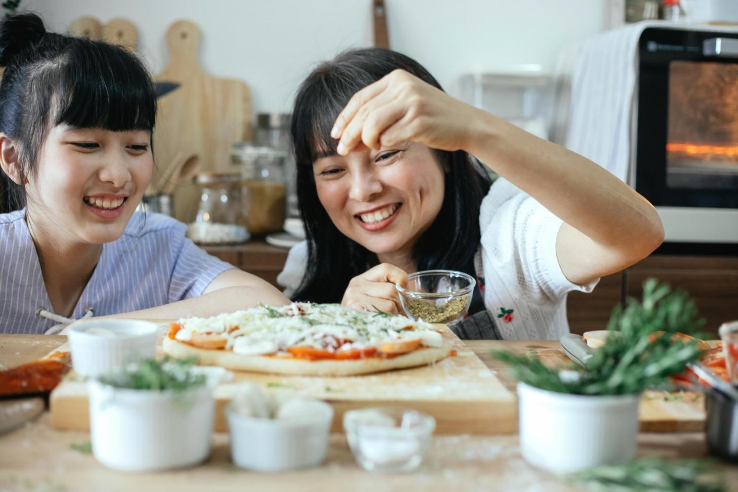 Instructor preparing traditional dish using authentic regional techniques